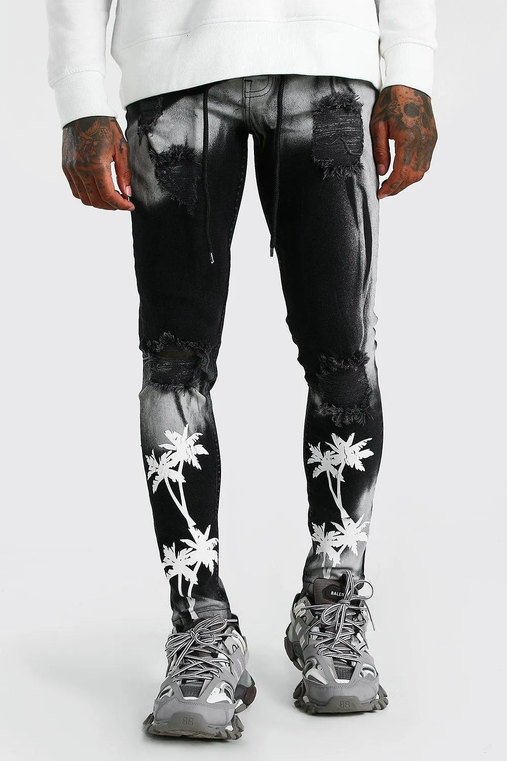 Super Skinny Bleached Distressed Palm Print Jeans | boohooMAN UK